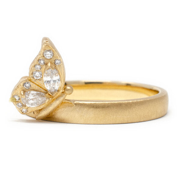 18k yellow gold ring with a perched butterfly with diamonds.
