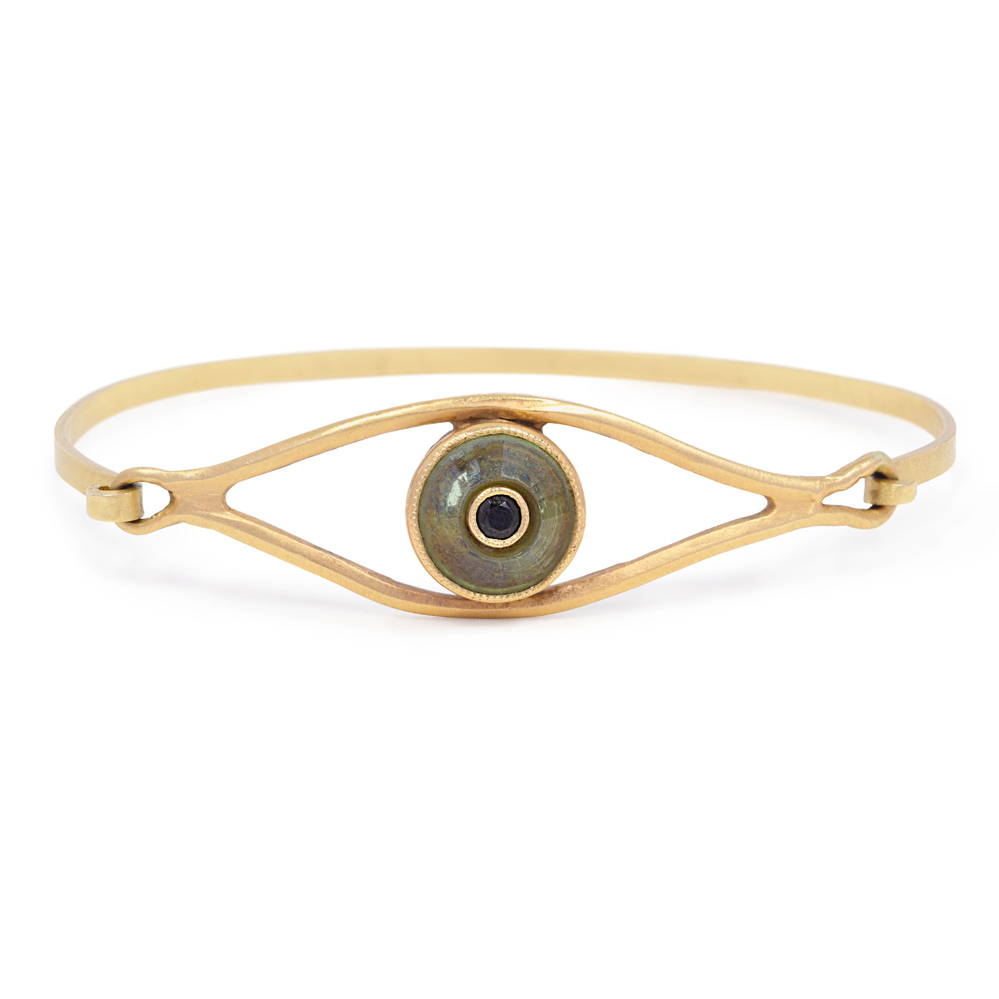 Gold bracelet with an eye design on a white background