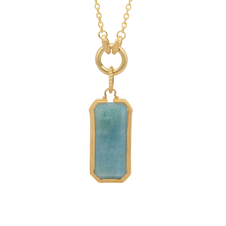 Gold necklace with a rectangular green stone pendant on a white background