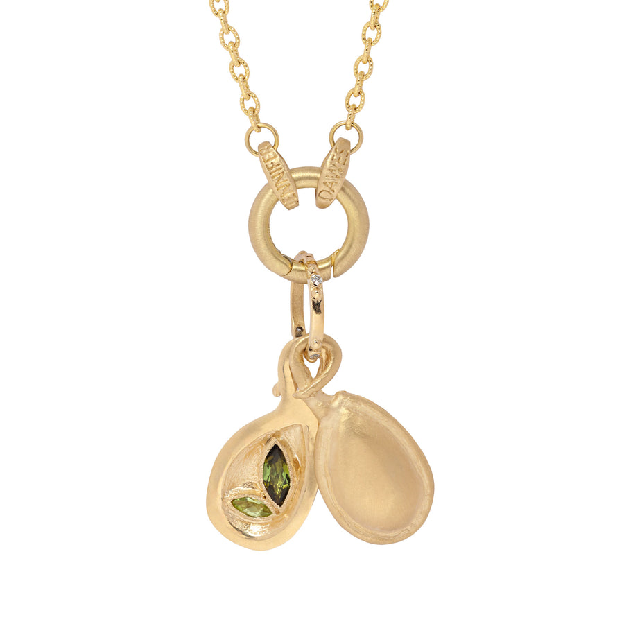 Gold necklace with a pendant featuring a green gemstone on a white background